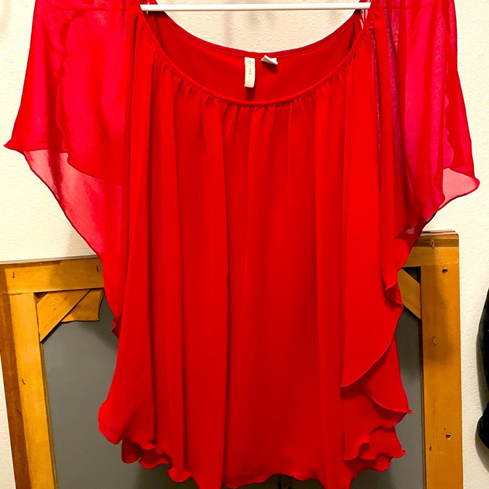 Flowy red blouse.